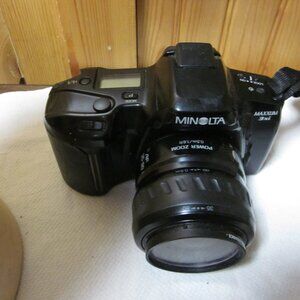 Minolta Maxium 35 mm film camera vtg with xtra 80 m lense film lense cover book